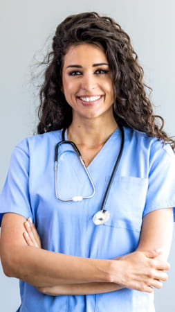 Women in scrubs smiling