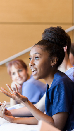 Female student speaking in a classroom