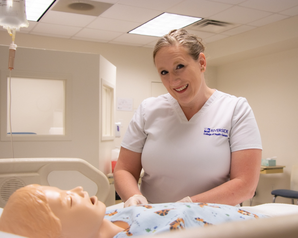 Female student working with a mannequin