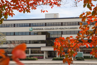 Administrative building surrounded by fall leaves