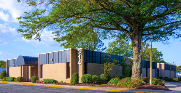 Classroom building next to a large tree