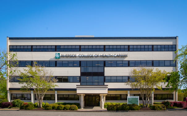 Photo of the admin building on a bright and sunny day.